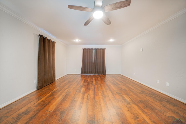 empty room with ceiling fan, dark hardwood / wood-style flooring, and ornamental molding