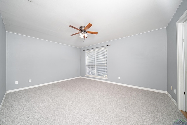 spare room with carpet flooring and ceiling fan