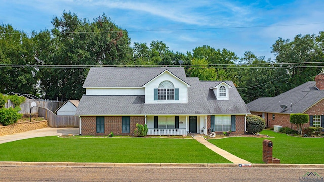 view of front of home featuring a porch and a front lawn