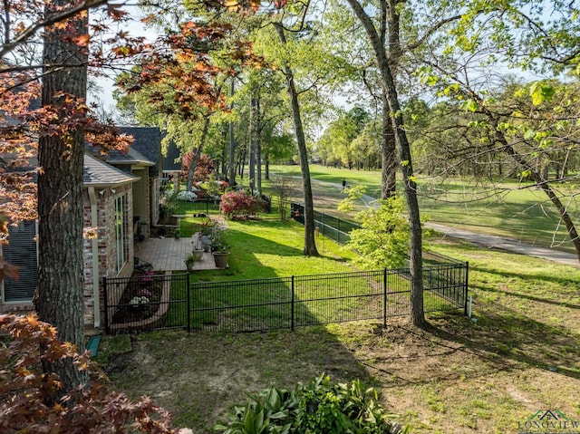 exterior space featuring a yard and fence