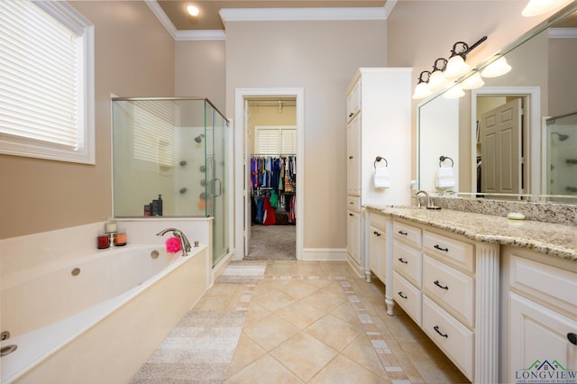 bathroom featuring tile patterned floors, a garden tub, vanity, and a stall shower