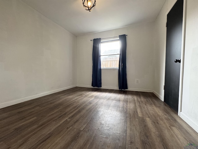 1612 Oden St, Longview, TX 75602 - unfurnished room with dark wood finished floors and baseboards