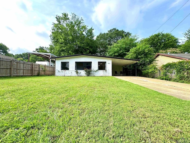 1612 Oden St, Longview, TX 75602 - view of outbuilding featuring concrete driveway and an attached carport
