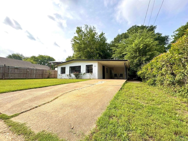 1612 Oden St, Longview, TX 75602 - view of outdoor structure with concrete driveway and a carport