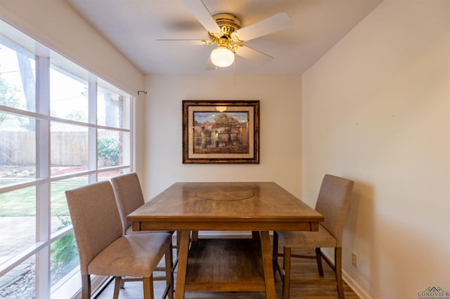 1900 Franklin Dr, Longview, TX 75601 - dining room with plenty of natural light, ceiling fan, wood finished floors, and baseboards