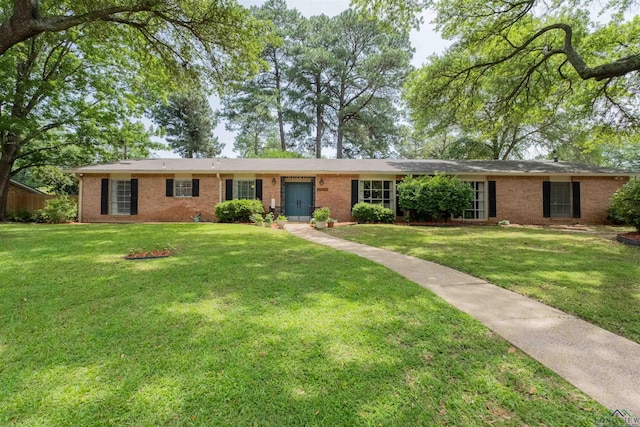 1900 Franklin Dr, Longview, TX 75601 - ranch-style home with brick siding and a front lawn