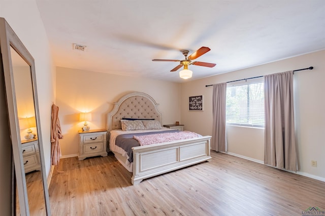 1900 Franklin Dr, Longview, TX 75601 - bedroom featuring light wood-style flooring, baseboards, and a ceiling fan