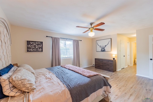 1900 Franklin Dr, Longview, TX 75601 - bedroom with light wood-style floors, baseboards, and a ceiling fan