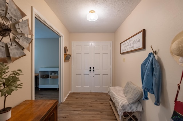 1900 Franklin Dr, Longview, TX 75601 - entryway with wood finished floors and a textured ceiling