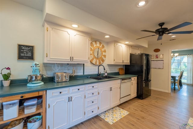 1900 Franklin Dr, Longview, TX 75601 - kitchen with white dishwasher, a sink, white cabinetry, and recessed lighting
