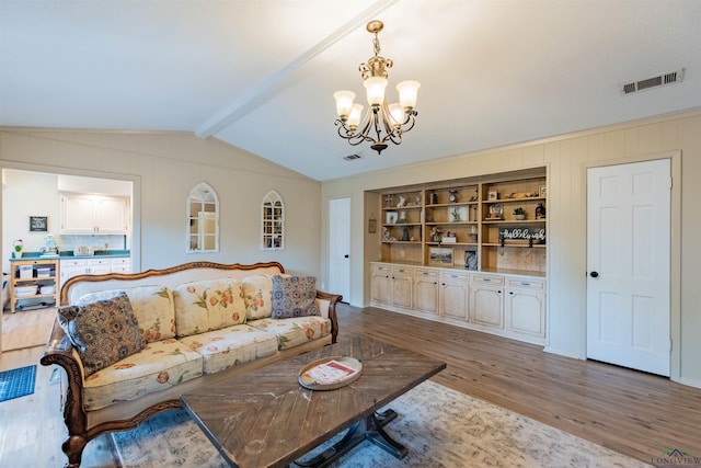 1900 Franklin Dr, Longview, TX 75601 - living room with a chandelier, wood finished floors, and wood walls
