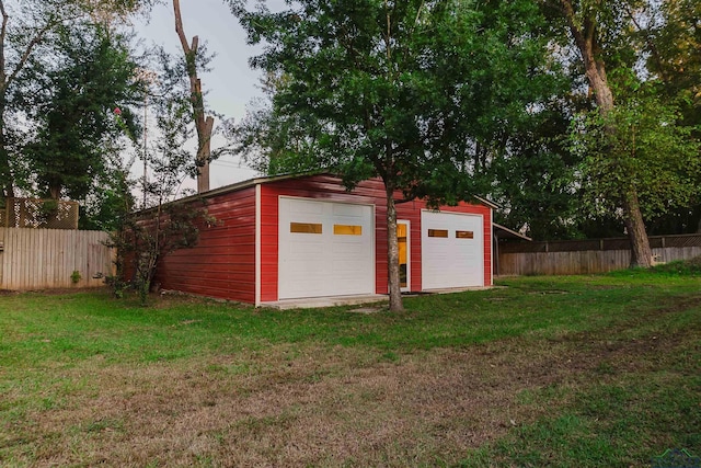 exterior space with a yard and a garage