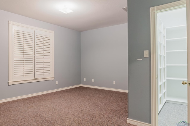 empty room featuring carpet floors