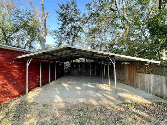 view of vehicle parking with a carport