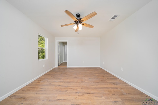 unfurnished room with ceiling fan and light wood-type flooring