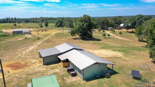 birds eye view of property with a rural view