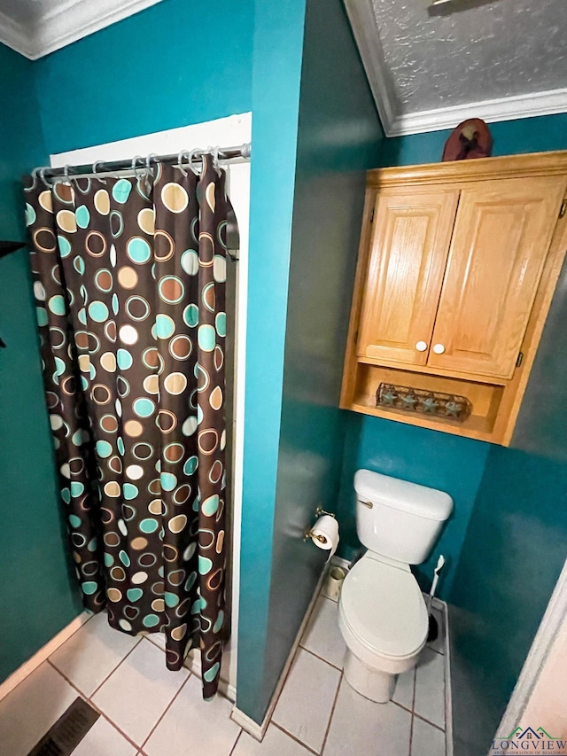 bathroom featuring walk in shower, crown molding, tile patterned flooring, and toilet