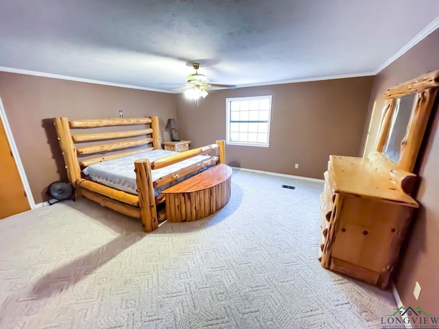 bedroom featuring carpet floors, crown molding, and ceiling fan