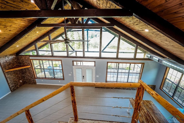 additional living space featuring french doors, tile patterned flooring, ceiling fan, beam ceiling, and wood ceiling