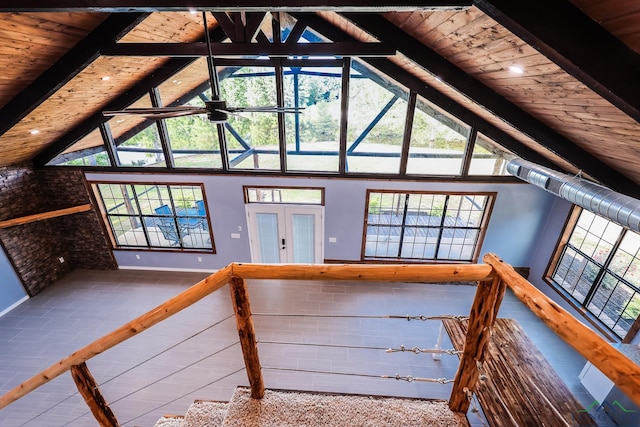 interior space with beamed ceiling, french doors, high vaulted ceiling, and wooden ceiling