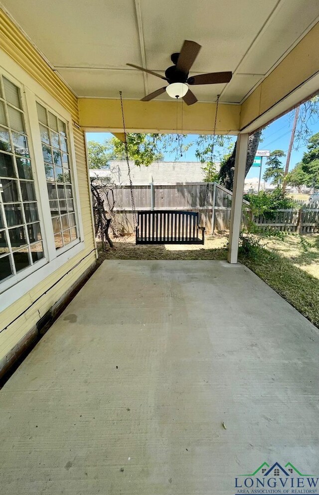 view of patio / terrace with fence and ceiling fan