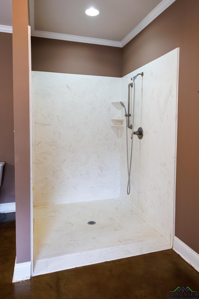 bathroom with a shower and ornamental molding