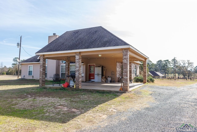 back of house featuring a patio area