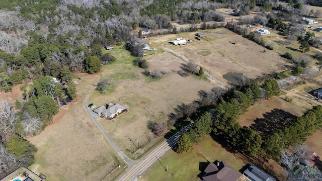 birds eye view of property with a rural view