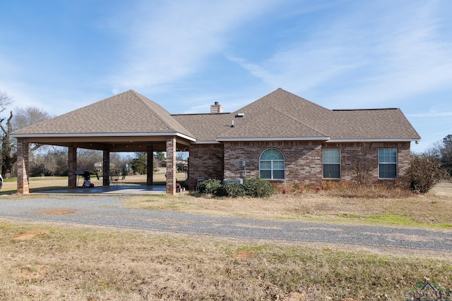 view of front of home with a carport