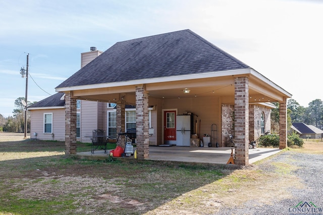 back of house with a patio area