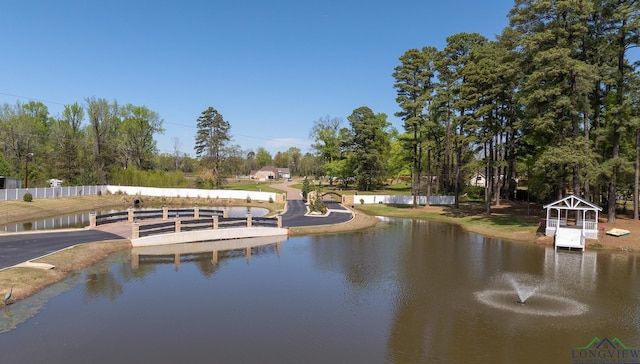 view of water feature featuring fence