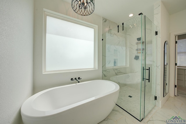 full bathroom with a freestanding bath, recessed lighting, marble finish floor, and a marble finish shower