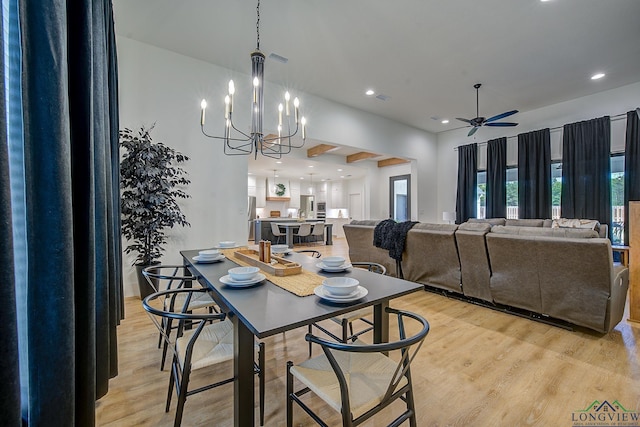 dining area with recessed lighting, light wood-style floors, ceiling fan with notable chandelier, and visible vents