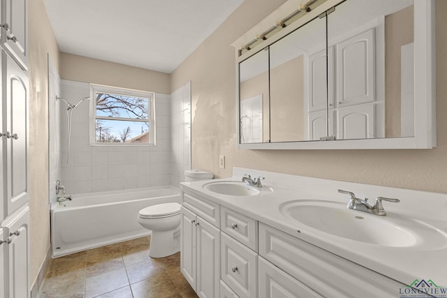 full bath featuring double vanity, washtub / shower combination, toilet, and a sink