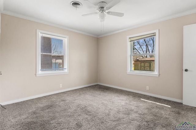 unfurnished room featuring visible vents, carpet, ceiling fan, and ornamental molding