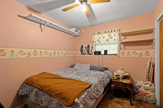 carpeted bedroom with a textured ceiling and ceiling fan