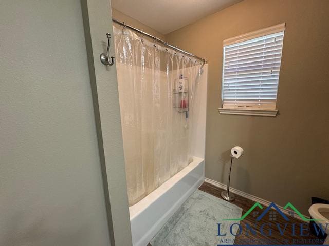 bathroom with shower / tub combo