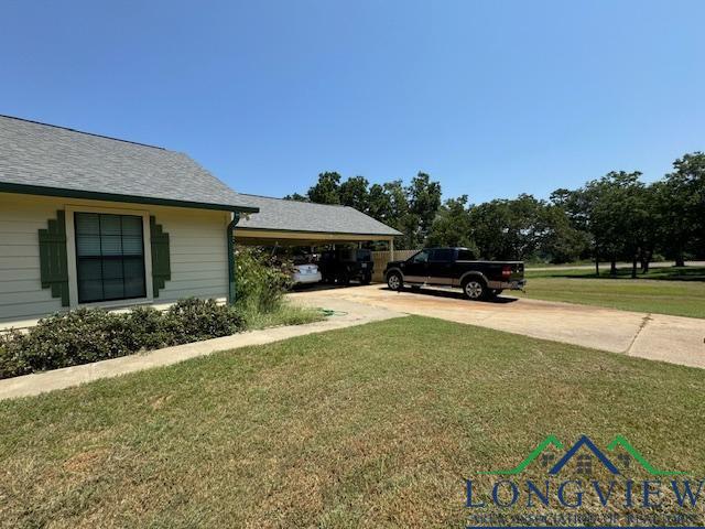 view of yard with a carport