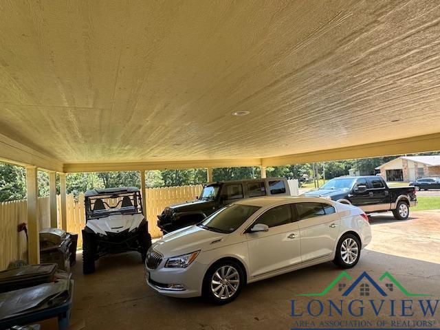 view of parking with a carport