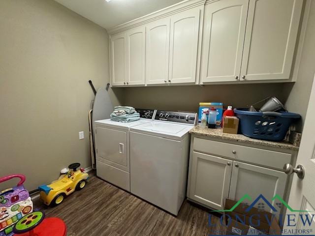 washroom featuring separate washer and dryer, cabinets, and dark hardwood / wood-style floors