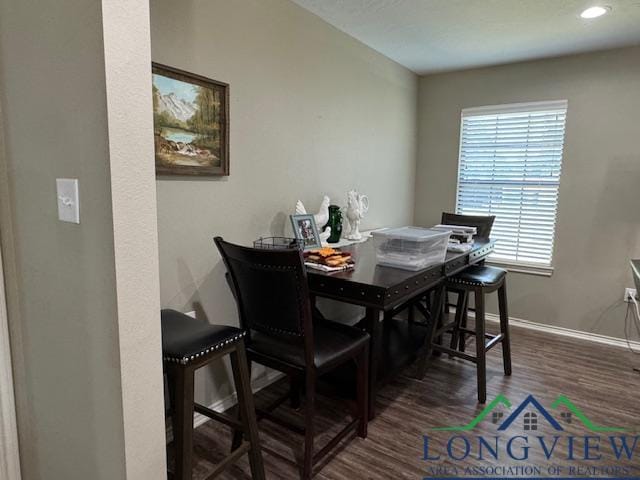 dining space with dark hardwood / wood-style floors