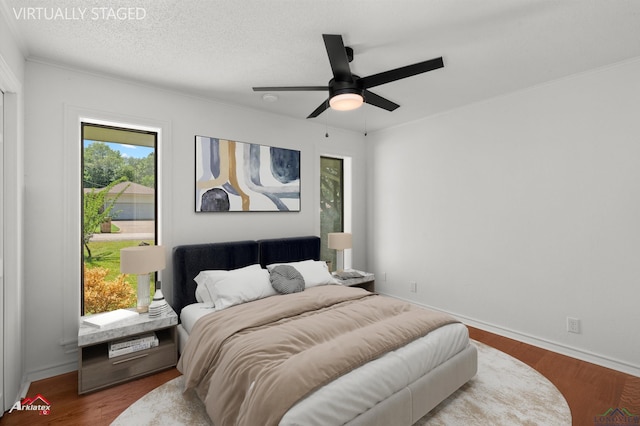 2804 Palm Plz, Marshall, TX 75672 - bedroom with wood finished floors, baseboards, and ceiling fan