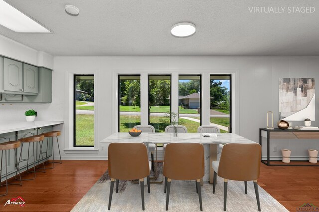 2804 Palm Plz, Marshall, TX 75672 - dining space with wood finished floors, plenty of natural light, and a textured ceiling
