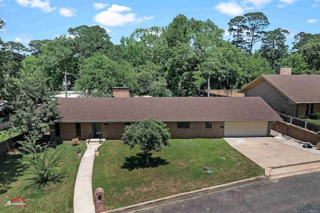2804 Palm Plz, Marshall, TX 75672 - ranch-style home with a chimney, brick siding, a garage, and a front yard