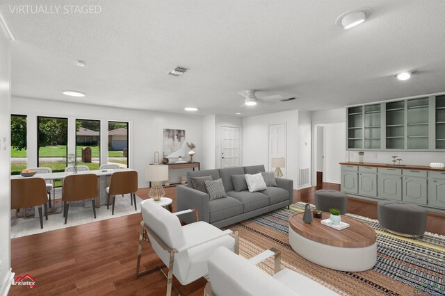 2804 Palm Plz, Marshall, TX 75672 - living area featuring dark wood finished floors, a ceiling fan, recessed lighting, baseboards, and a textured ceiling