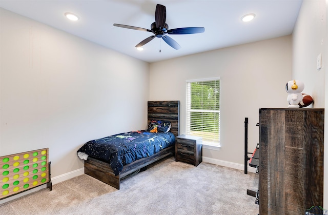 carpeted bedroom featuring ceiling fan, baseboards, and recessed lighting