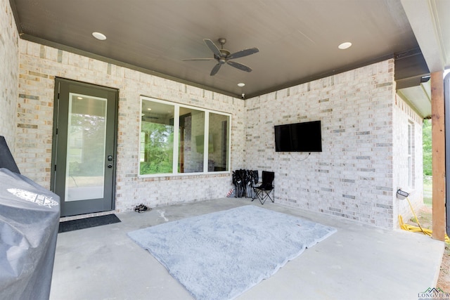 view of patio / terrace featuring ceiling fan
