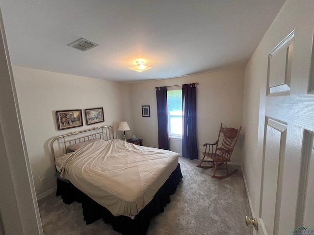 bedroom with light carpet