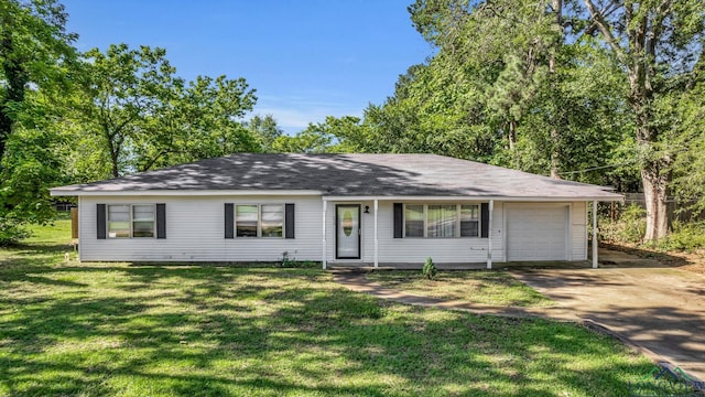 ranch-style home featuring a garage and a front lawn