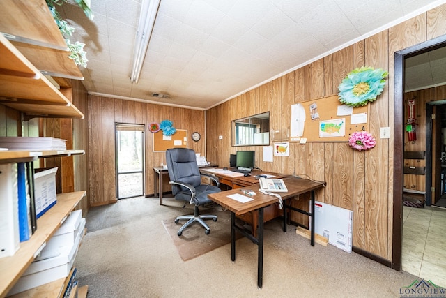 office space featuring light colored carpet and wood walls